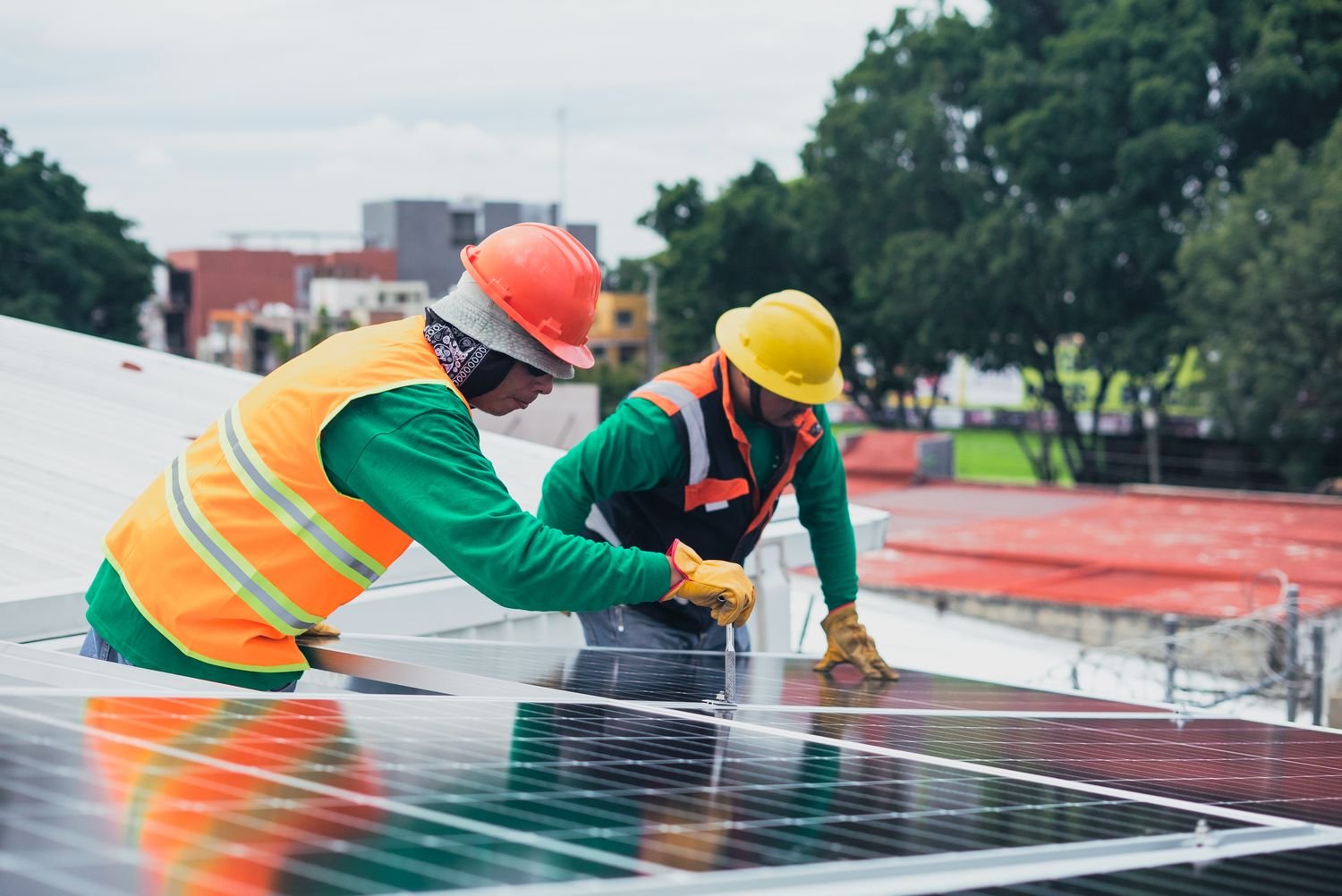 Solar technicians installing photovoltaic panels on site